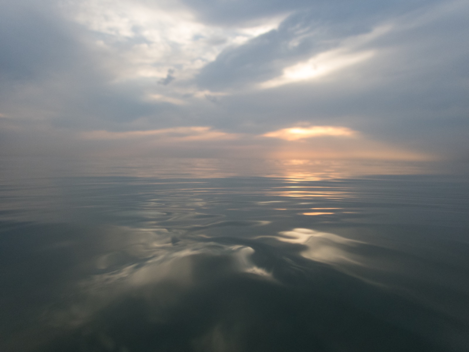 Still, calm water at dusk